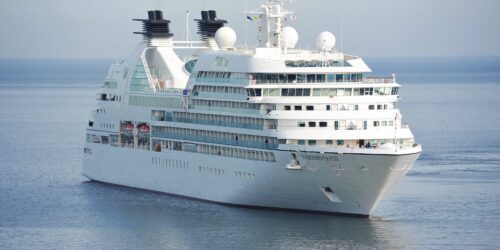 white cruise ship on blue body of water during daytime